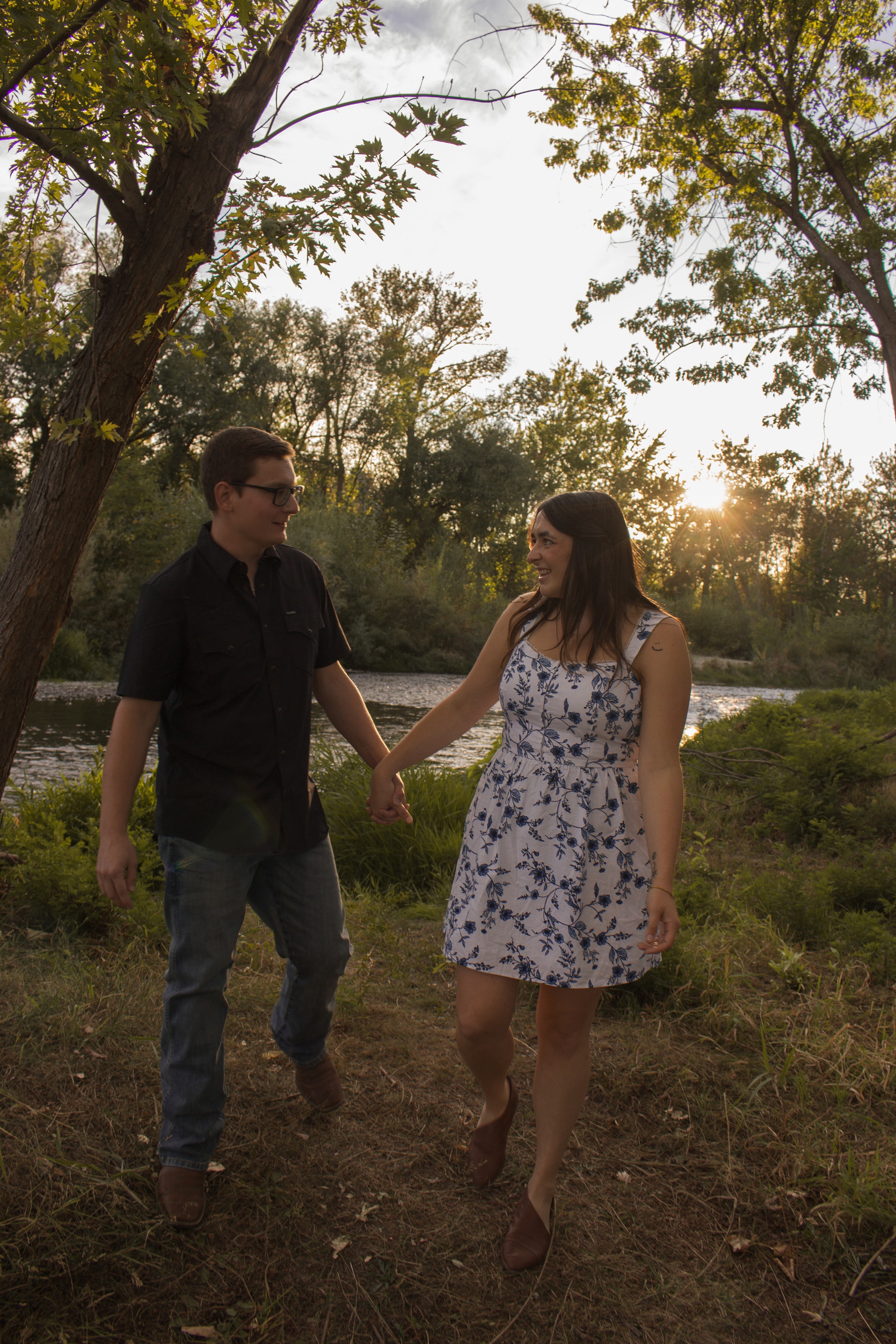 Couple walking hand in hand in autumn park